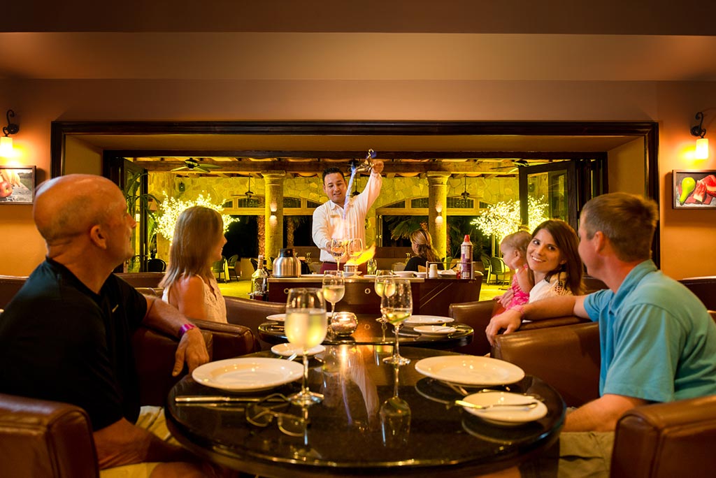 Photo of happy people at a Villa del Palmar restaurant and bar